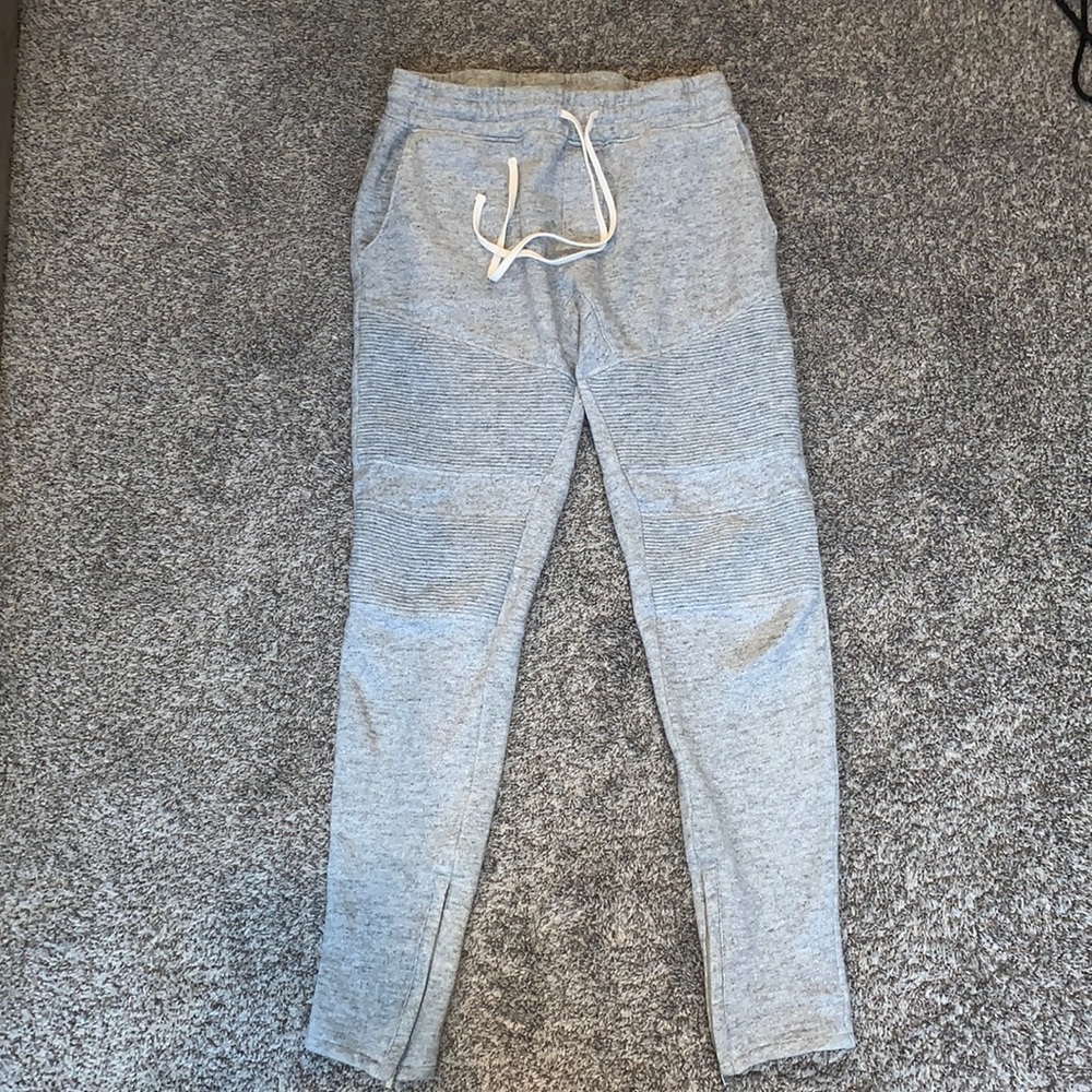 Gray sweatpants with zippers on legs
